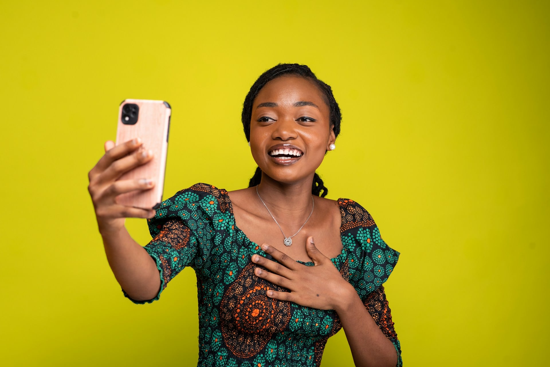 Woman with laptop looking camera